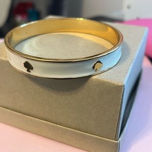 KATE SPADE like new ivory & gold bangle bracelet with 6 signature spade logos